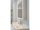 Updated bathroom featuring a modern sink, large mirror, and tiled shower at 875 White Sw St, Atlanta, GA 30310