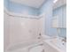 Clean, updated bathroom with white subway tile, blue walls, and modern fixtures at 875 White Sw St, Atlanta, GA 30310