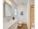 Well-maintained bathroom featuring a sleek vanity, tile flooring, and a tiled shower at 875 White Sw St, Atlanta, GA 30310