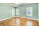 Bedroom features natural light, painted walls, trim, and hardwood floors at 875 White Sw St, Atlanta, GA 30310