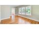 The bright bedroom features hardwood floors, multiple windows, and an adjacent room at 875 White Sw St, Atlanta, GA 30310
