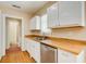 Updated kitchen with stainless steel dishwasher and butcher block countertops at 875 White Sw St, Atlanta, GA 30310