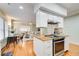 Well-appointed kitchen with butcher block island, stainless steel appliances, and an open view to living spaces at 875 White Sw St, Atlanta, GA 30310