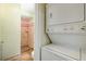 Laundry area with stackable washer and dryer and adjacent shower at 875 White Sw St, Atlanta, GA 30310