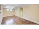 Spacious living room with gleaming hardwood floors and natural light from double windows at 875 White Sw St, Atlanta, GA 30310