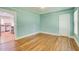 Inviting living room featuring hardwood floors, fresh paint, and an open doorway to the kitchen at 875 White Sw St, Atlanta, GA 30310
