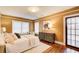 Relaxing main bedroom showcasing hardwood floors, a dresser, and a cozy seating area at 875 White Sw St, Atlanta, GA 30310