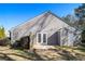 Backyard view featuring a patio, double doors, neutral siding and green grass at 1025 Lakeside Circle, Covington, GA 30016