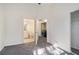 Bright bedroom with neutral carpet, with an ensuite bathroom and laundry room for added convenience at 1025 Lakeside Circle, Covington, GA 30016