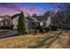 Charming home featuring a well-manicured lawn and inviting curb appeal under a stunning sky at 1025 Lakeside Circle, Covington, GA 30016