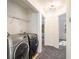 Convenient laundry room with modern appliances and ample storage space at 1025 Lakeside Circle, Covington, GA 30016