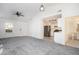 Inviting, carpeted living room provides access to a modern kitchen and a well-lit bathroom at 1025 Lakeside Circle, Covington, GA 30016