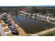 Stunning aerial view of lakeside community featuring beautiful homes, lush greenery, and serene lake views at 15 Azalea Lakes Ct, Dallas, GA 30157
