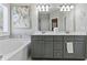 Bright bathroom featuring double sink vanity, soaking tub, and elegant decor for a spa-like retreat at 15 Azalea Lakes Ct, Dallas, GA 30157