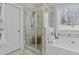 Bathroom featuring a separate shower, soaking tub, and natural light at 15 Azalea Lakes Ct, Dallas, GA 30157