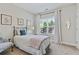 Bright bedroom with natural light, featuring simple decor and perfect spot for rest and relaxation at 15 Azalea Lakes Ct, Dallas, GA 30157