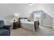 Cozy bedroom with slanted ceilings, natural light and relaxing furnishings, perfect for unwinding at 15 Azalea Lakes Ct, Dallas, GA 30157