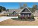 Charming single-Gathering home featuring a well-manicured lawn and mature landscaping at 15 Azalea Lakes Ct, Dallas, GA 30157