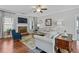 Bright living room offers hardwood floors, fireplace, neutral tones, and a ceiling fan at 15 Azalea Lakes Ct, Dallas, GA 30157