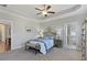 Spacious main bedroom with tray ceiling, ensuite bathroom and comfortable sitting area at 15 Azalea Lakes Ct, Dallas, GA 30157