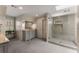 Spacious bathroom with a glass shower, double vanities, and modern fixtures, providing a spa-like experience at 9835 Trace Vly, Sandy Springs, GA 30350
