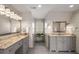 Elegant bathroom with dual vanities, marble countertops, and plenty of natural light at 9835 Trace Vly, Sandy Springs, GA 30350