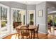 Bright breakfast nook with lots of natural light and a view of the deck at 9835 Trace Vly, Sandy Springs, GA 30350