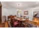 Traditional dining room with hardwood floors, decorative chandelier, and classic furnishings on an ornate rug at 9835 Trace Vly, Sandy Springs, GA 30350