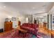 Spacious living room with hardwood floors and a vibrant area rug at 9835 Trace Vly, Sandy Springs, GA 30350
