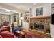 Inviting living room featuring a stone fireplace, built-in shelves, and comfortable seating at 9835 Trace Vly, Sandy Springs, GA 30350