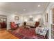 Traditional living room featuring hardwood floors, classic furnishings, and a large ornate area rug at 9835 Trace Vly, Sandy Springs, GA 30350