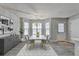 Bright dining room featuring modern chandelier, stylish decor, and large windows at 2892 Norfair Ne Loop, Lithonia, GA 30038