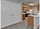 Cozy kitchen with grey walls, wood cabinets, and white appliances at 2892 Norfair Ne Loop, Lithonia, GA 30038