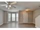 Inviting living room with hardwood floors, neutral paint, and ample natural light at 2892 Norfair Ne Loop, Lithonia, GA 30038