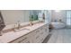 Bright bathroom featuring double vanity, soaking tub, and modern finishes at 363 Wilcrest Dr, Lawrenceville, GA 30044