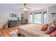 Bright bedroom boasts hardwood floors and natural light streaming through large windows at 363 Wilcrest Dr, Lawrenceville, GA 30044