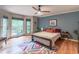 Sunlit bedroom with hardwood floors and stylish decor at 363 Wilcrest Dr, Lawrenceville, GA 30044