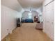 Spacious carpeted bonus room with a vaulted ceiling, complemented by a ceiling fan and a well-lit window at 363 Wilcrest Dr, Lawrenceville, GA 30044