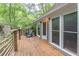 View of the wooden deck with lounge chair, wooden railing, and home exterior at 363 Wilcrest Dr, Lawrenceville, GA 30044