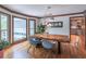 Dining room boasts modern lighting, natural light, and view into the kitchen at 363 Wilcrest Dr, Lawrenceville, GA 30044