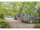 Charming two-story home featuring a spacious driveway, attached garage and beautiful mature landscaping at 363 Wilcrest Dr, Lawrenceville, GA 30044