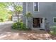 Exterior shot shows the side of the house, including a garage accessible via a paved driveway at 363 Wilcrest Dr, Lawrenceville, GA 30044