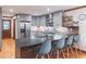 Kitchen with modern appliances, stylish island seating, and gray cabinets at 363 Wilcrest Dr, Lawrenceville, GA 30044