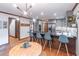 Modern kitchen features gray cabinets, stainless steel appliances, large island with seating, and stylish light fixture at 363 Wilcrest Dr, Lawrenceville, GA 30044