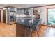 Spacious kitchen boasts granite counters, stainless appliances, gray cabinets, and island seating at 363 Wilcrest Dr, Lawrenceville, GA 30044