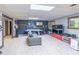 Spacious living room features a pool table, comfortable gray sofa, and a wall-mounted television for entertainment at 363 Wilcrest Dr, Lawrenceville, GA 30044