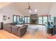 Bright living room with vaulted ceiling, brick fireplace, and wood floors at 363 Wilcrest Dr, Lawrenceville, GA 30044
