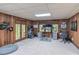 Cozy office featuring wood paneling, natural light from the windows, and an arcade game for entertainment at 363 Wilcrest Dr, Lawrenceville, GA 30044