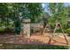 Fun playground with climbing wall, slide, swings and bridge with views of the lake beyond at 363 Wilcrest Dr, Lawrenceville, GA 30044