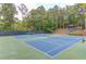 Well-maintained tennis courts in a serene, wooded setting, perfect for sports enthusiasts at 363 Wilcrest Dr, Lawrenceville, GA 30044